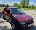 Красный Опель Корса, объемом двигателя 1.2 л и пробегом 235 тыс. км за 2200 $, фото 1 на Automoto.ua