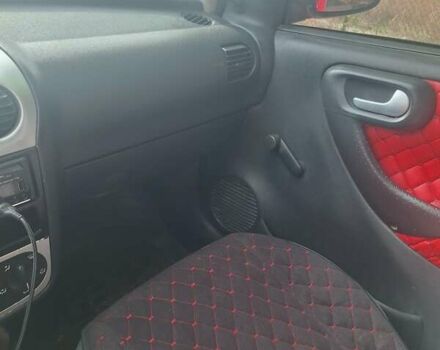 Опель Корса 2003 в Каменское - Днепродзержинск на Automoto.ua Красный Опель Корса, объемом двигателя 1 л и пробегом 153 тыс. км за 3200 $, фото 8 на Automoto.ua