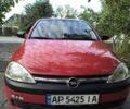 Красный Опель Корса, объемом двигателя 1 л и пробегом 170 тыс. км за 3300 $, фото 1 на Automoto.ua