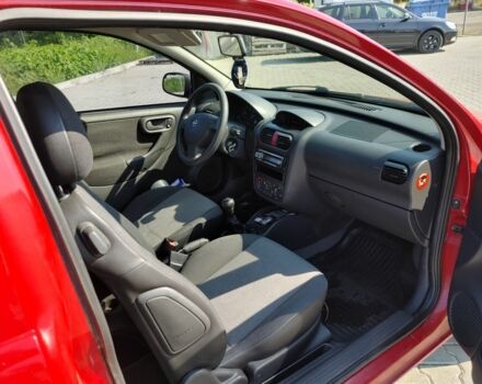 Красный Опель Корса, объемом двигателя 1 л и пробегом 194 тыс. км за 1900 $, фото 3 на Automoto.ua