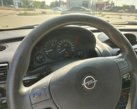 Красный Опель Корса, объемом двигателя 1 л и пробегом 194 тыс. км за 1900 $, фото 20 на Automoto.ua