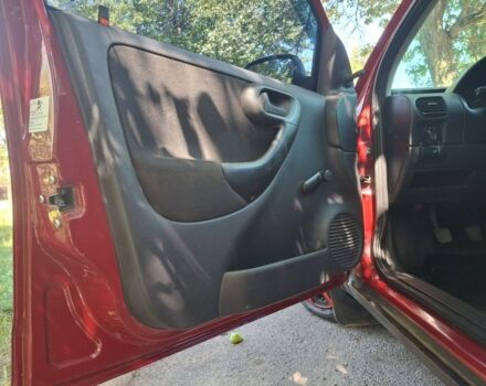 Красный Опель Корса, объемом двигателя 1.2 л и пробегом 201 тыс. км за 2700 $, фото 2 на Automoto.ua