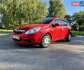 Красный Опель Корса, объемом двигателя 1.23 л и пробегом 135 тыс. км за 6000 $, фото 1 на Automoto.ua