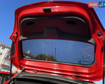 Красный Опель Корса, объемом двигателя 1.23 л и пробегом 135 тыс. км за 6000 $, фото 33 на Automoto.ua