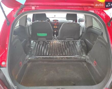 Красный Опель Корса, объемом двигателя 1.2 л и пробегом 195 тыс. км за 5000 $, фото 4 на Automoto.ua