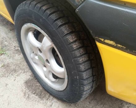 Желтый Опель Корса, объемом двигателя 1 л и пробегом 380 тыс. км за 2500 $, фото 13 на Automoto.ua