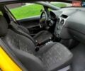 Желтый Опель Корса, объемом двигателя 1.23 л и пробегом 176 тыс. км за 5750 $, фото 1 на Automoto.ua