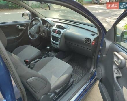 Синий Опель Корса, объемом двигателя 1 л и пробегом 214 тыс. км за 2900 $, фото 2 на Automoto.ua