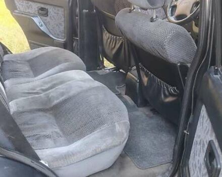 Черный Опель Фронтера, объемом двигателя 2.4 л и пробегом 319 тыс. км за 4300 $, фото 1 на Automoto.ua