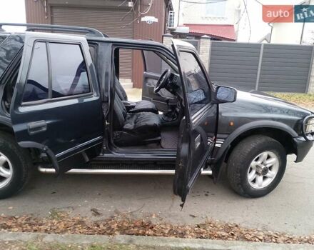 Черный Опель Фронтера, объемом двигателя 2.2 л и пробегом 329 тыс. км за 4999 $, фото 1 на Automoto.ua