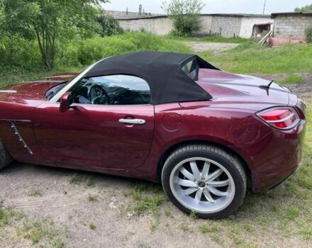 Красный Опель ГТ, объемом двигателя 2 л и пробегом 225 тыс. км за 12500 $, фото 2 на Automoto.ua