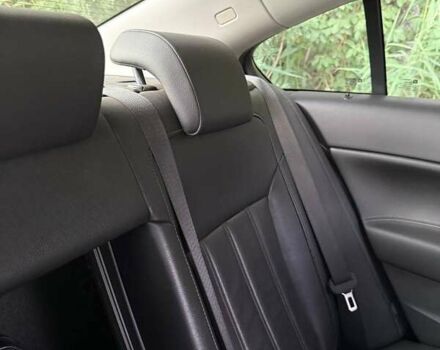 Білий Опель Інсігнія, об'ємом двигуна 2 л та пробігом 165 тис. км за 9500 $, фото 3 на Automoto.ua