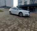 Белый Опель Инсигния, объемом двигателя 2 л и пробегом 225 тыс. км за 7000 $, фото 1 на Automoto.ua