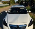 Білий Опель Інсігнія, об'ємом двигуна 2 л та пробігом 263 тис. км за 7199 $, фото 1 на Automoto.ua