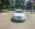 Белый Опель Инсигния, объемом двигателя 1.96 л и пробегом 310 тыс. км за 6500 $, фото 1 на Automoto.ua