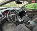 Білий Опель Інсігнія, об'ємом двигуна 2 л та пробігом 195 тис. км за 7999 $, фото 6 на Automoto.ua