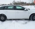 Білий Опель Інсігнія, об'ємом двигуна 2 л та пробігом 245 тис. км за 8299 $, фото 3 на Automoto.ua