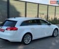 Белый Опель Инсигния, объемом двигателя 2 л и пробегом 130 тыс. км за 9300 $, фото 25 на Automoto.ua