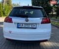 Білий Опель Інсігнія, об'ємом двигуна 2 л та пробігом 256 тис. км за 7999 $, фото 4 на Automoto.ua