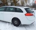 Білий Опель Інсігнія, об'ємом двигуна 2 л та пробігом 245 тис. км за 8299 $, фото 12 на Automoto.ua