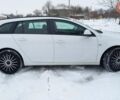 Білий Опель Інсігнія, об'ємом двигуна 2 л та пробігом 245 тис. км за 8299 $, фото 3 на Automoto.ua