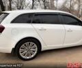 Білий Опель Інсігнія, об'ємом двигуна 2 л та пробігом 224 тис. км за 10999 $, фото 6 на Automoto.ua