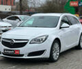 Білий Опель Інсігнія, об'ємом двигуна 2 л та пробігом 198 тис. км за 10490 $, фото 1 на Automoto.ua