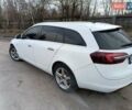Білий Опель Інсігнія, об'ємом двигуна 1.96 л та пробігом 300 тис. км за 12999 $, фото 5 на Automoto.ua