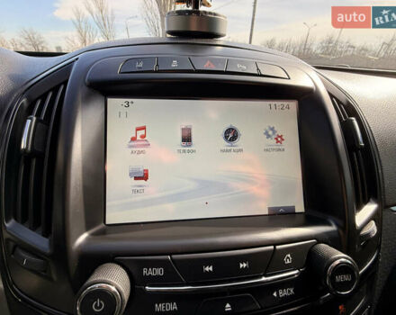 Білий Опель Інсігнія, об'ємом двигуна 2 л та пробігом 221 тис. км за 11600 $, фото 20 на Automoto.ua