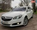 Белый Опель Инсигния, объемом двигателя 2 л и пробегом 224 тыс. км за 10600 $, фото 1 на Automoto.ua