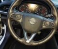 Білий Опель Інсігнія, об'ємом двигуна 2 л та пробігом 233 тис. км за 13500 $, фото 4 на Automoto.ua