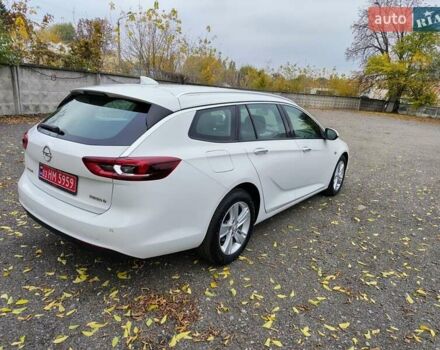 Білий Опель Інсігнія, об'ємом двигуна 2 л та пробігом 245 тис. км за 15700 $, фото 4 на Automoto.ua