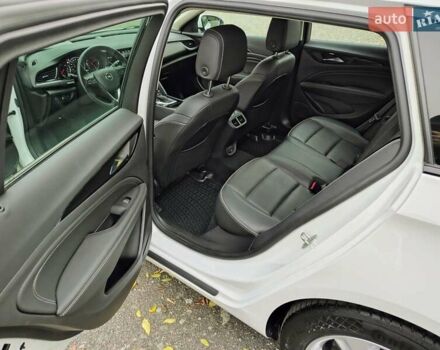 Білий Опель Інсігнія, об'ємом двигуна 2 л та пробігом 245 тис. км за 15700 $, фото 7 на Automoto.ua