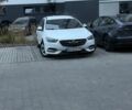 Білий Опель Інсігнія, об'ємом двигуна 2 л та пробігом 240 тис. км за 14200 $, фото 1 на Automoto.ua