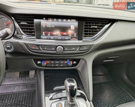 Білий Опель Інсігнія, об'ємом двигуна 2 л та пробігом 245 тис. км за 15700 $, фото 20 на Automoto.ua