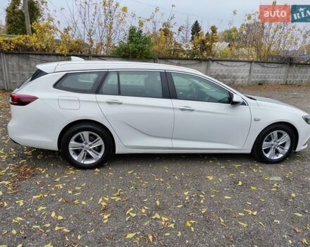 Білий Опель Інсігнія, об'ємом двигуна 2 л та пробігом 245 тис. км за 15700 $, фото 5 на Automoto.ua