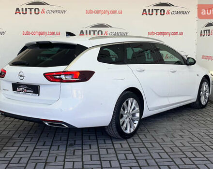 Білий Опель Інсігнія, об'ємом двигуна 1.96 л та пробігом 145 тис. км за 19750 $, фото 2 на Automoto.ua