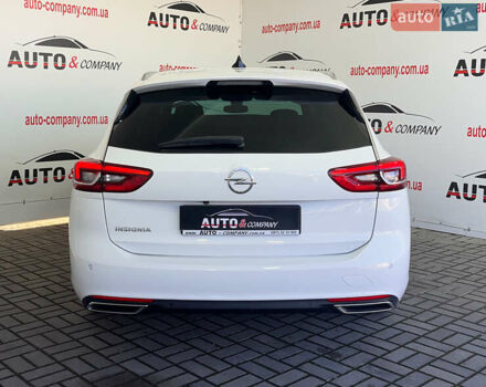 Белый Опель Инсигния, объемом двигателя 1.96 л и пробегом 145 тыс. км за 19750 $, фото 3 на Automoto.ua