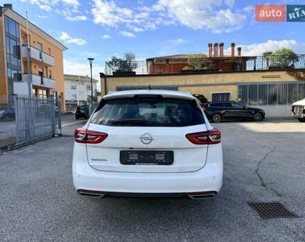 Білий Опель Інсігнія, об'ємом двигуна 2 л та пробігом 103 тис. км за 14500 $, фото 6 на Automoto.ua