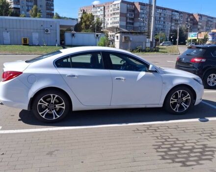 Білий Опель Інсігнія, об'ємом двигуна 2 л та пробігом 172 тис. км за 7700 $, фото 1 на Automoto.ua