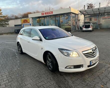 Білий Опель Інсігнія, об'ємом двигуна 2 л та пробігом 325 тис. км за 7600 $, фото 1 на Automoto.ua