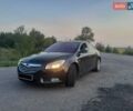 Черный Опель Инсигния, объемом двигателя 2 л и пробегом 267 тыс. км за 8000 $, фото 1 на Automoto.ua