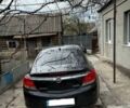 Черный Опель Инсигния, объемом двигателя 2 л и пробегом 255 тыс. км за 7300 $, фото 1 на Automoto.ua