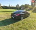 Черный Опель Инсигния, объемом двигателя 2 л и пробегом 295 тыс. км за 7800 $, фото 2 на Automoto.ua