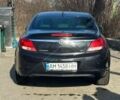 Чорний Опель Інсігнія, об'ємом двигуна 2 л та пробігом 227 тис. км за 8000 $, фото 1 на Automoto.ua