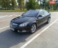 Чорний Опель Інсігнія, об'ємом двигуна 1.96 л та пробігом 180 тис. км за 8950 $, фото 1 на Automoto.ua