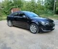 Черный Опель Инсигния, объемом двигателя 2 л и пробегом 204 тыс. км за 9997 $, фото 1 на Automoto.ua