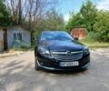 Черный Опель Инсигния, объемом двигателя 2 л и пробегом 204 тыс. км за 9997 $, фото 1 на Automoto.ua