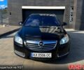 Черный Опель Инсигния, объемом двигателя 2 л и пробегом 205 тыс. км за 7900 $, фото 1 на Automoto.ua