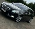 Чорний Опель Інсігнія, об'ємом двигуна 2 л та пробігом 249 тис. км за 8600 $, фото 1 на Automoto.ua